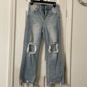 Trendy Light Blue Flare Jeans with Distressed Details